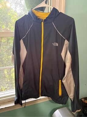 The North Face Black Jacket with Yellow Trim and Gray Panels